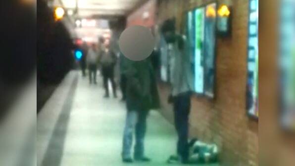 Furor over photo of NY subway death, suspect questioned