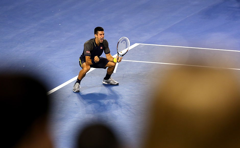 Novak Djokovic of Serbia celebrates winning championship point in his men's final match against Andy Murray of Great Britain. Quinn Rooney/Getty Images