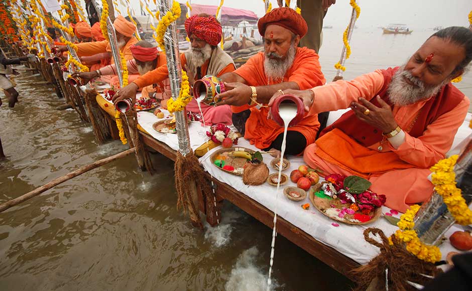 Holy men offer prayers to the Ganga ahead of the Maha Kumbh festival in Allahabad. AP Holy men offer prayers to the Ganga ahead of the Maha Kumbh festival in Allahabad. AP