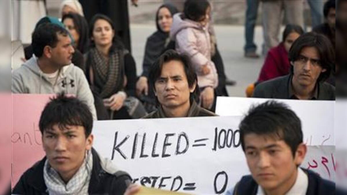 Pakistan Shi'ites watch over 96 bomb dead for 2nd night – Firstpost