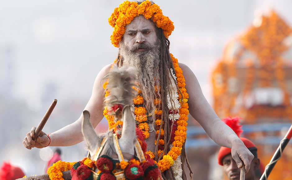A Naga Sadhu participate in a religious procession towards the Sangam, the confluence of rivers Ganges, Yamuna and mythical Saraswati, as part of the Maha Kumbh festival in Allahabad. Rajesh Kumar Singh/AP A Naga Sadhu participate in a religious procession towards the Sangam, the confluence of rivers Ganges, Yamuna and mythical Saraswati, as part of the Maha Kumbh festival in Allahabad. Rajesh Kumar Singh/AP
