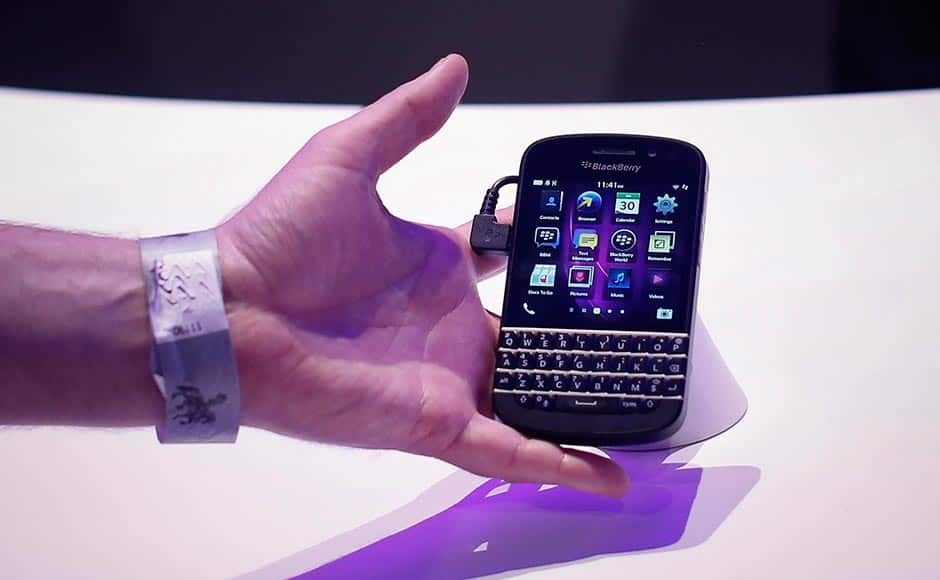 An attendee reaches out to the newly launched BlackBerry Q10 device. Shannon Stapleton/ Reuters 