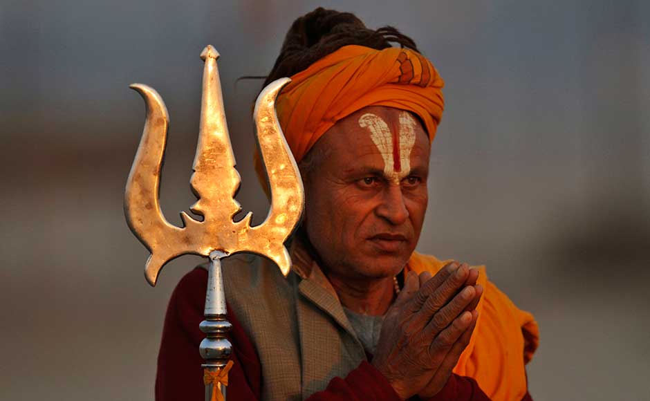 A Sadhu offers prayers to the setting sun on the banks of Sangam during the Maha Kumbh mela in Allahabad.. Rajesh Kumar Singh/AP A Sadhu offers prayers to the setting sun on the banks of Sangam during the Maha Kumbh mela in Allahabad.. Rajesh Kumar Singh/AP