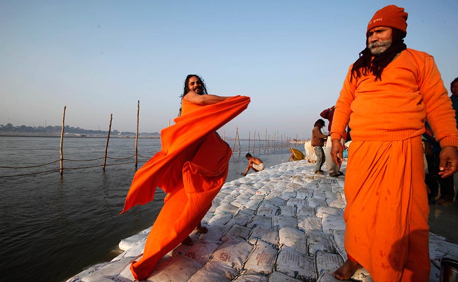 A Sadhu gets dressed after taking a dip at Sangam at Allahabad. Rajesh Kumar Singh/AP A Sadhu gets dressed after taking a dip at Sangam at Allahabad. Rajesh Kumar Singh/AP