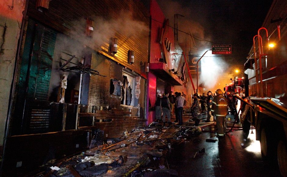 Firefighters work to douse a fire at the Kiss Club in Santa Maria city, Rio Grande do Sul state, Brazil, Sunday, Jan 27, 2013. AP