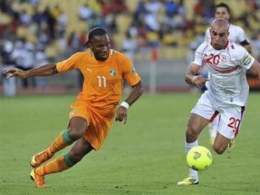 Ivory Coast's Drogba challenges Tunisia's Abdennour during their African Nations Cup Group D soccer match in Rustenburg. Reuters