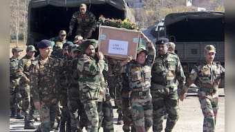 Images: Pak envoy summoned, soldiers' bodies taken home