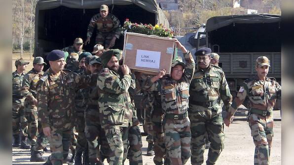 Images: Pak envoy summoned, soldiers' bodies taken home