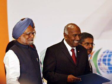 File photo of Indian Prime Minister Manmohan Singh (L) and Suriname Vice-President Ramdien Sardjoe. AFP