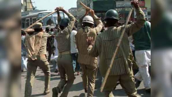 Lawbreaker? IPS official thrashes liquor trader in Bihar
