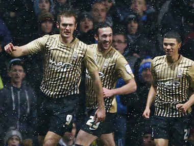 Bradford City's Hanson celebrates with teammates after scoring during their English League Cup semi-final second leg soccer match against Aston Villa in Birmingham. Reuters