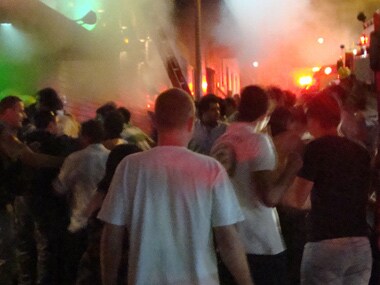 A crowd stands outside the Kiss nightclub after a fire broke out inside the club in Santa Maria city, Rio Grande do Sul state, Brazil on Sunday. AP