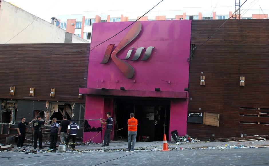 Police investigators inspect the entrance of the Kiss nightclub in Santa Maria city, Rio Grande do Sul state, Brazil, Sunday, Jan 27, 2013. AP