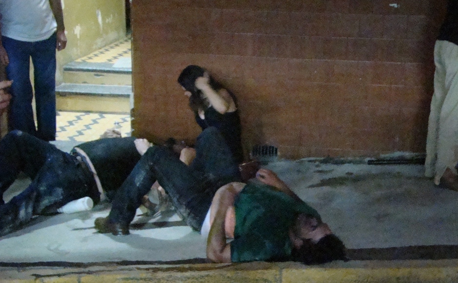 Injured people lies on the ground outside the Kiss nightclub in Santa Maria city, Rio Grande do Sul state, Brazil, Sunday, Jan 27, 2013. AP