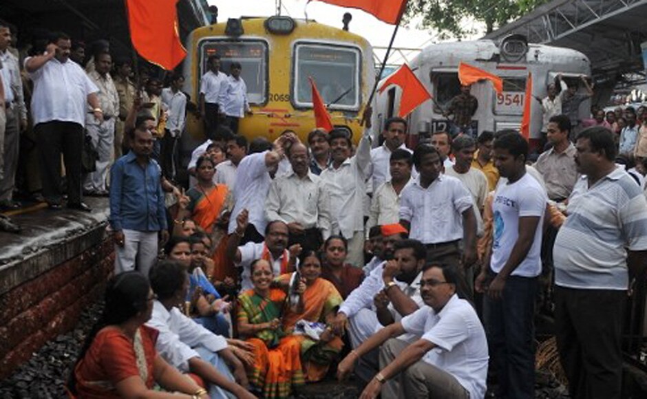 Shiv Sena party workers shout slogans as they stop local trains during a nationwide strike in protest of fuel price hikes in Mumbai on 5 July, 2010. The strike was called by the main opposition Bharatiya Janata Party (BJP) and leftist parties in a concerted show of strength against the Congress-led government's reform programme. AFP Shiv Sena party workers shout slogans as they stop local trains during a nationwide strike in protest of fuel price hikes in Mumbai on 5 July, 2010. The strike was called by the main opposition Bharatiya Janata Party (BJP) and leftist parties in a concerted show of strength against the Congress-led government's reform programme. AFP