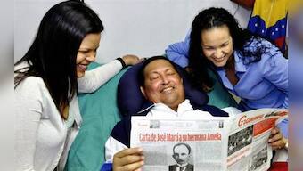 Venezuela shows first Chavez photos, says has trouble speaking