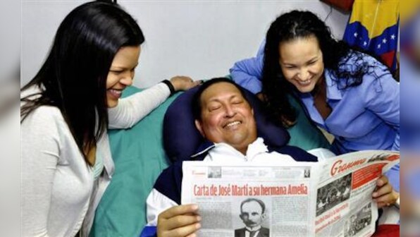 Venezuela shows first Chavez photos, says has trouble speaking