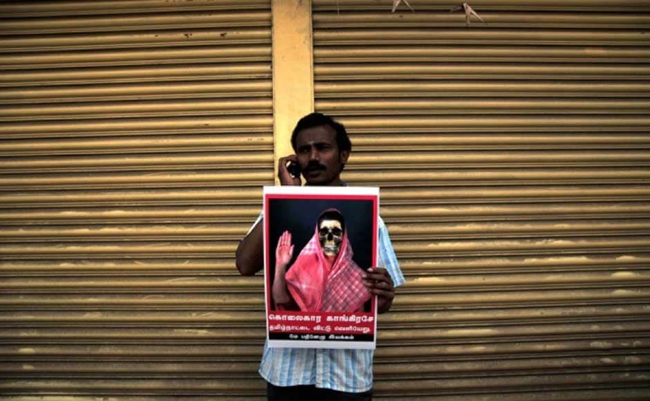 A participant in the protest rally in Chennai against the Congress for not taking action against the Sri Lankan government over alleged war crimes committed. Firstpost A participant in the protest rally in Chennai against the Congress for not taking action against the Sri Lankan government over alleged war crimes committed. Firstpost