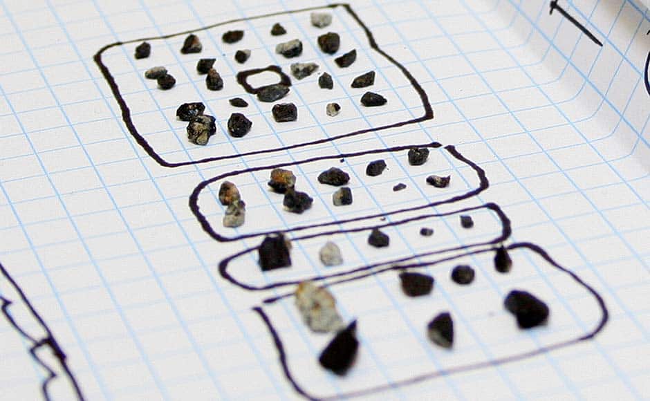 In this photo distributed by the Urals Federal University Press Service pieces of a meteorite are seen in a laboratory in Yekaterinburg. Researchers from the Urals Federal University, based in Yekaterinburg, have determined that the small stone-like pieces found near Lake Cherbarkul in the Chelyabinsk region are pieces of the meteorite that exploded over the region on 15 February. The Urals Federal University Press Service, Alexander Khlopotov/ AP 
