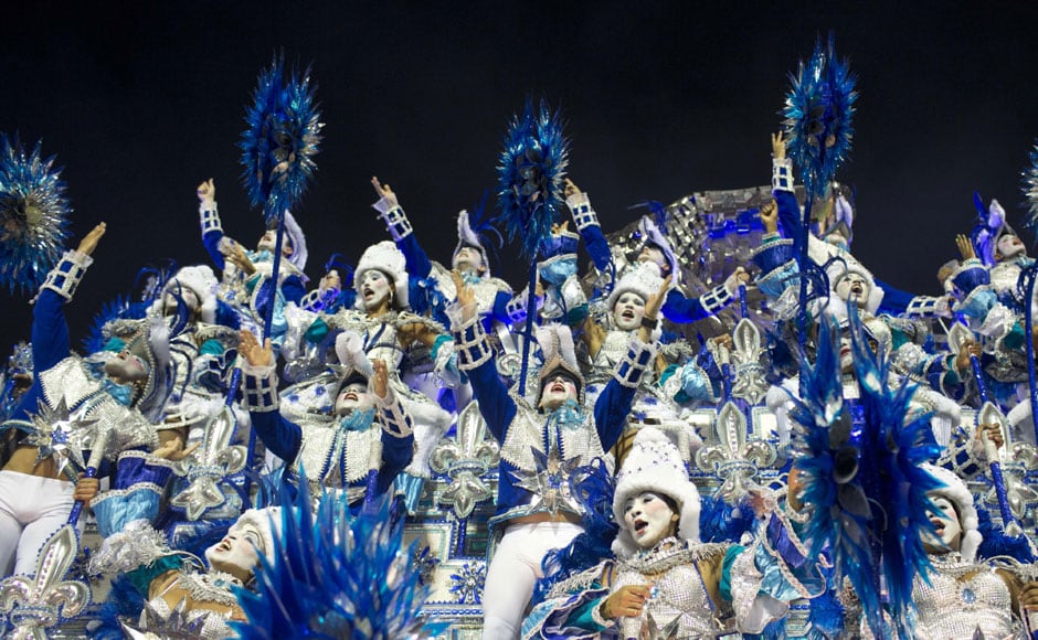 Performers from the Beija Flor samba school parade on a float during carnival celebrations at the Sambadrome in Rio de Janeiro. AP