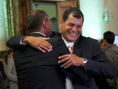 Ecuador’s President Rafael Correa celebrates with his Vice President-elect Jorge Glass after hearing results at Carondelet Palace in Quito. Reuters
