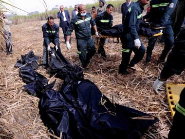 Egyptian rescue workers carry the dead bodies of foreign tourists, near the scene of a balloon crash outside al-Dhabaa village, just west of Luxor. AP 