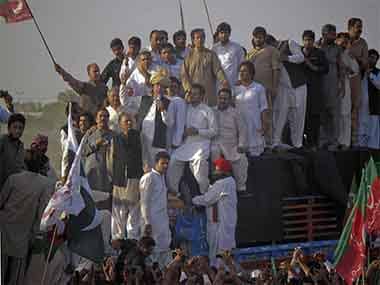 Pakistan Tehreek-e-Insaf (PTI) head Imran Khan, wearing a traditional turban, speaks to supporters during a peace march against U.S. drone strikes. Reuters