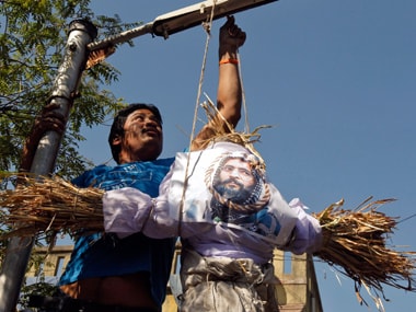 A demonstrator hangs an effigy depicting Mohammad Afzal Guru. Reuters