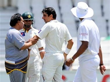 Pakistan team doctor examines Misbah-ul-Haq's elbow after being bowled by Morne Morkel. AP
