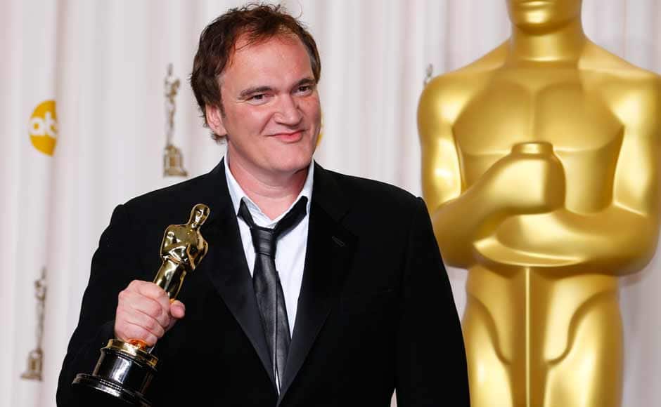 Director Quentin Tarantino poses with his Oscar for best original screenplay for 