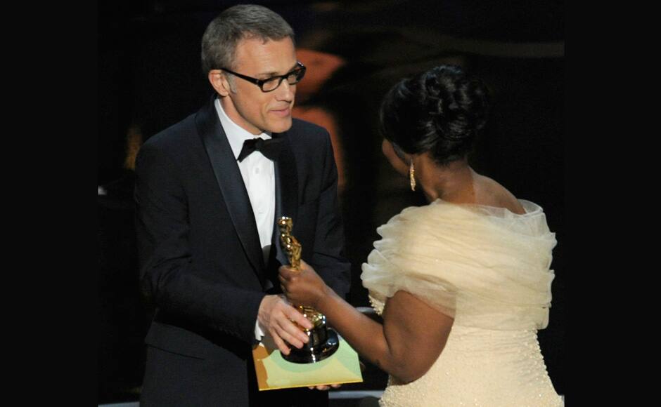 Actress Octavia Spencer, right, presents the award for best actor in a supporting role for 
