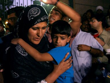 Afzal Guru’s wife Tabassum and son Ghalib. Reuters.