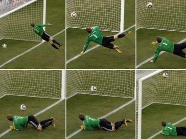 Germany's goalkeeper Manuel Neuer looks at a ball that hit the bar to bounce over the line during the World Cup. AP