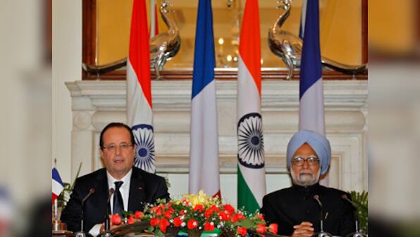 Hollande, Manmohan ink four agreements, discuss Jaitapur