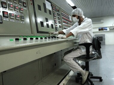 An Iranian technician works at the uranium conversion facility just outside the city of Isfahan 410 kilometers south of the capital Tehran, Iran. AP