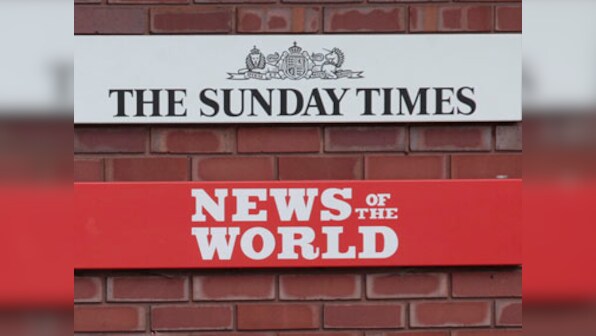 UK police arrest 6 in phone hacking probe 
