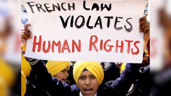 Turban ban: Sikhs urge Sushma to raise issue with French Prez