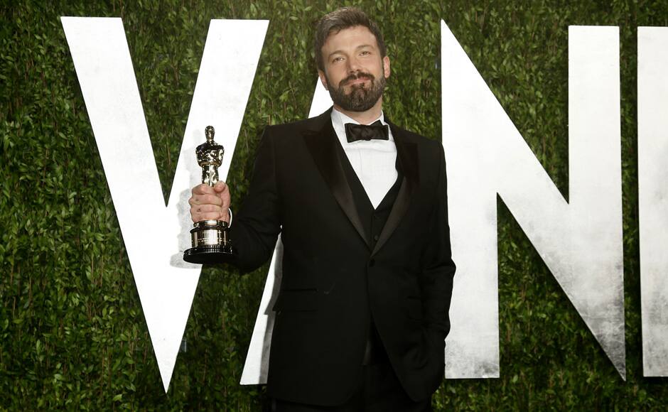 Director Ben Affleck holds his best picture award for his film 
