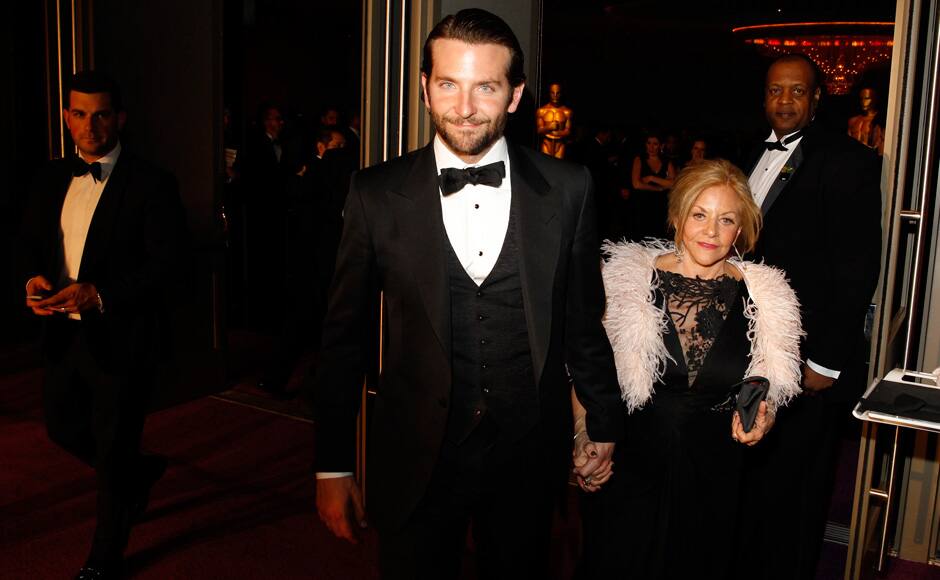 Bradley Cooper (L) and his mother Gloria Cooper arrive at the Governors Ball for the 85th Academy Awards in Hollywood, California February 24, 2013. Reuters 