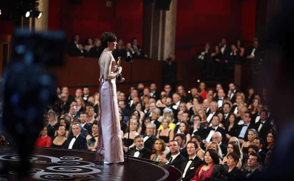 Anne Hathaway accepts the award for best actress in a supporting role for 