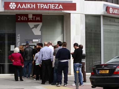 Extra security, limits on transfers as Cyprus banks prepare to reopen Extra security, limits on transfers as Cyprus banks prepare to reopen
