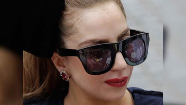 Lady Gaga using 24 carat gold plated wheelchair