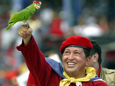 Hugo Chavez, seen here with a ‘revolutionary parrot’, transformed Venezuela, not always for the better. Reuters