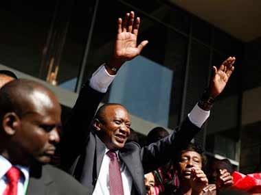Kenyan president elect Uhuru Kenyatta waves at supporters after winning the elections in Nairobi. AP