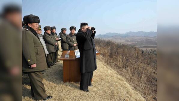 UN imposes new sanctions on N-Korea, Kim visits frontline