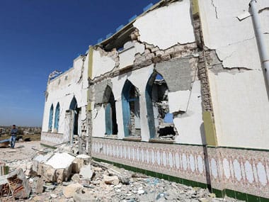 Libyans inspect the damage at a Sufi shrine in the neighbourhood of Tajoura, on the outskirts of Tripoli, after is was attacked during the early hours of the morning. AFP