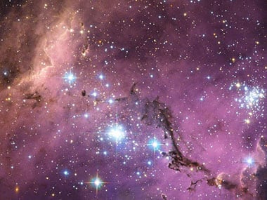 The Large Magellanic Cloud (LMC) is ablaze with star-forming regions. From the Tarantula Nebula, the brightest stellar nursery in our cosmic neighborhood, to LHA 120-N 11, part of which is featured in this Hubble image, the small and irregular galaxy is scattered with glowing nebulae, the most noticeable sign that new stars are being born. Image Credit: ESA/NASA/Hubble