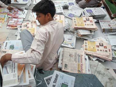Selling newspapers. Reuters