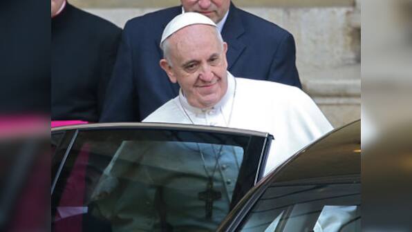 Pope Francis displays humility, stops by hotel to collect luggage