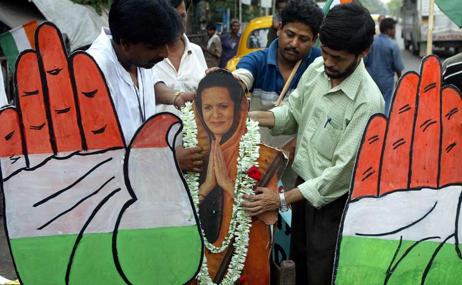 Activists of Congress Party put garlands on a cutout of party president Sonia Gandhi in Calcutta in May 2004 after the party swept back to power as India voted out the BJP. Prime Minister Atal Behari Vajpayee conceded defeat. Reuters